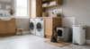 best cat litter disposal system setup next to a litter box in a clean laundry room
