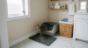 where to put a litter box in a small apartment bathroom corner with open litter box and cat